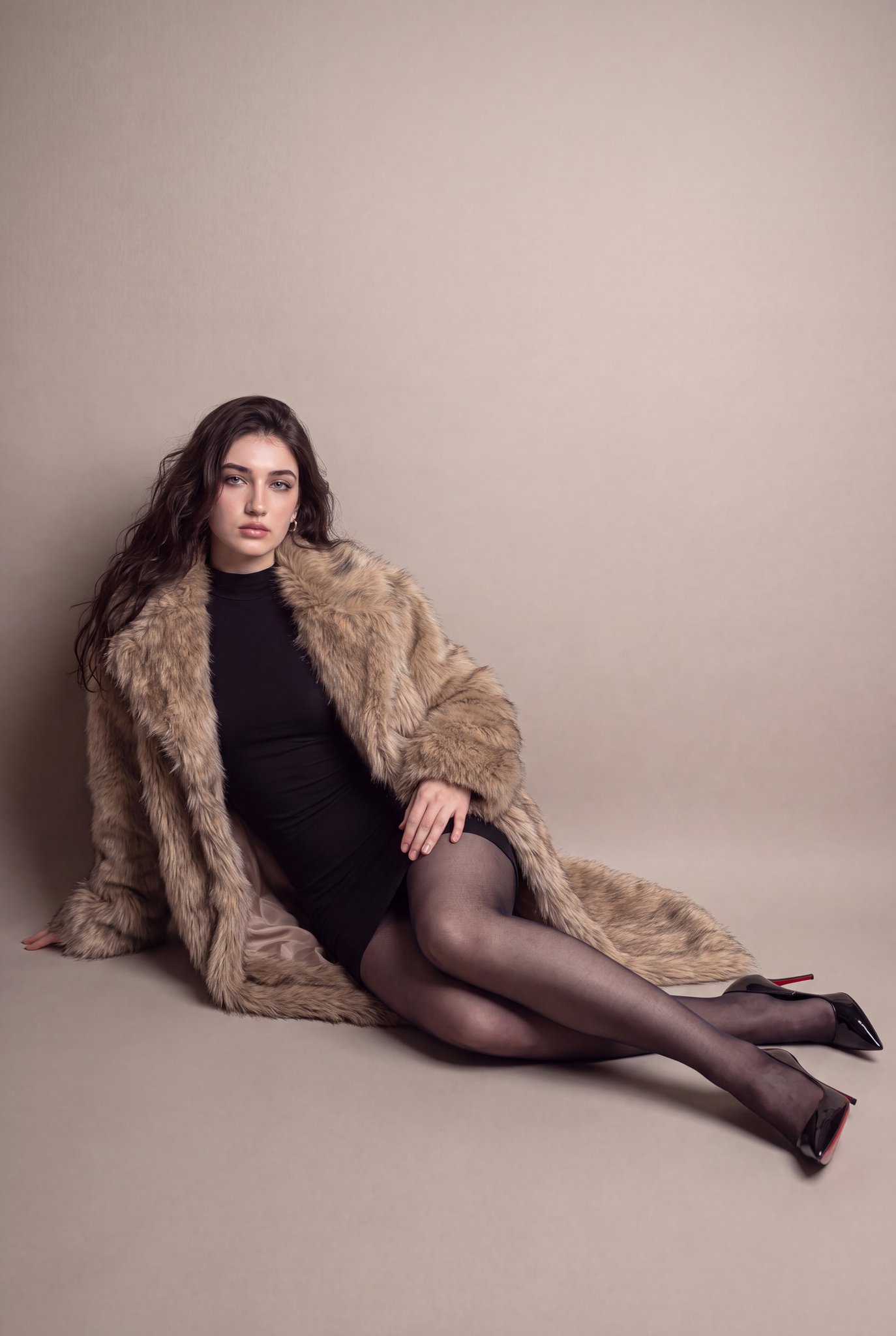 Ultra-Realistic Woman Seated on Studio Floor in Elegant Editorial Pose AI image prompt example 2