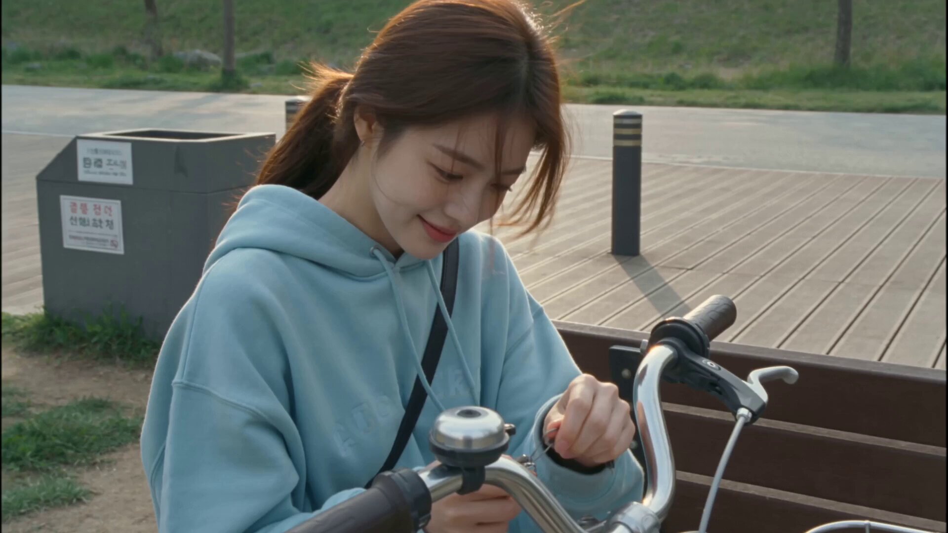 Young Korean woman cycling along Han River path AI video prompt example